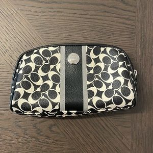 Black & white COACH makeup bag.